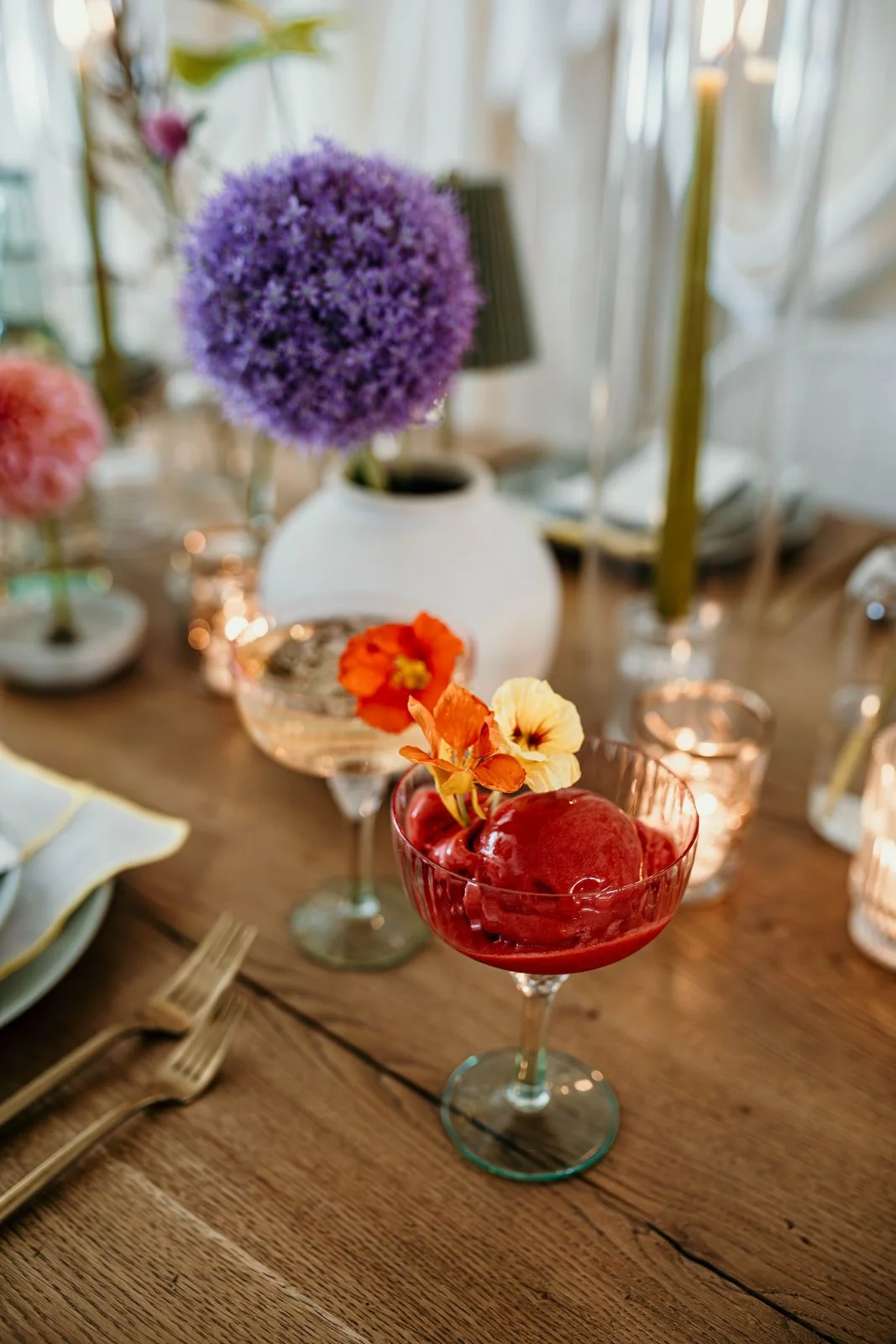 Freezing Point Co handcrafted frozen dessert in a coupe glass garnished with edible flowers